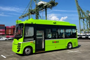 Autonomous electric bus at a Singapore port, showcasing smart charging and fleet management technology