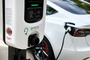EV Tech home EV charger powering a white electric vehicle with TrendPower smart charging software support